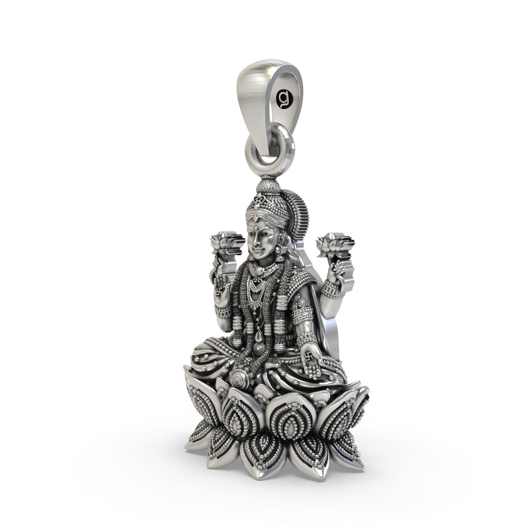 Close-up detail of handcrafted silver Mahalakshmi pendant showing the blessing mudra.