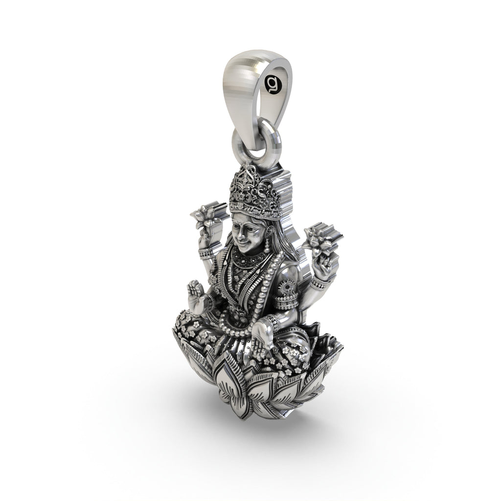 Side angle of the handcrafted silver Lakshmi pendant featuring blooming lotuses.