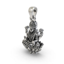 Side angle of the handcrafted silver Lakshmi pendant featuring blooming lotuses.