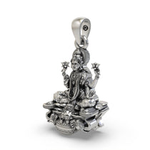 Close-up detail of the oxidized silver Gajalakshmi pendant showing intricate elephants and kalash.