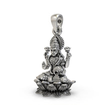 Close-up of the silver Lakshmi pendant showing Goddess Mahalakshmi on a lotus with blessing mudra.
