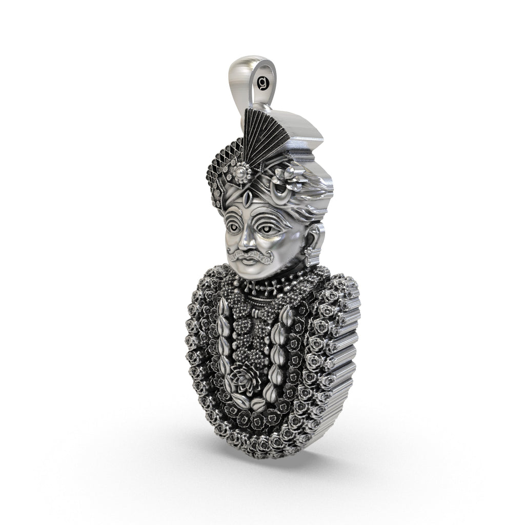 Close-up of the handcrafted silver Mahakal pendant showing the ornate mukut and oxidized temple finish.
