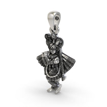 Side profile view of the detailed silver Banke Bihari Vrindavan temple pendant