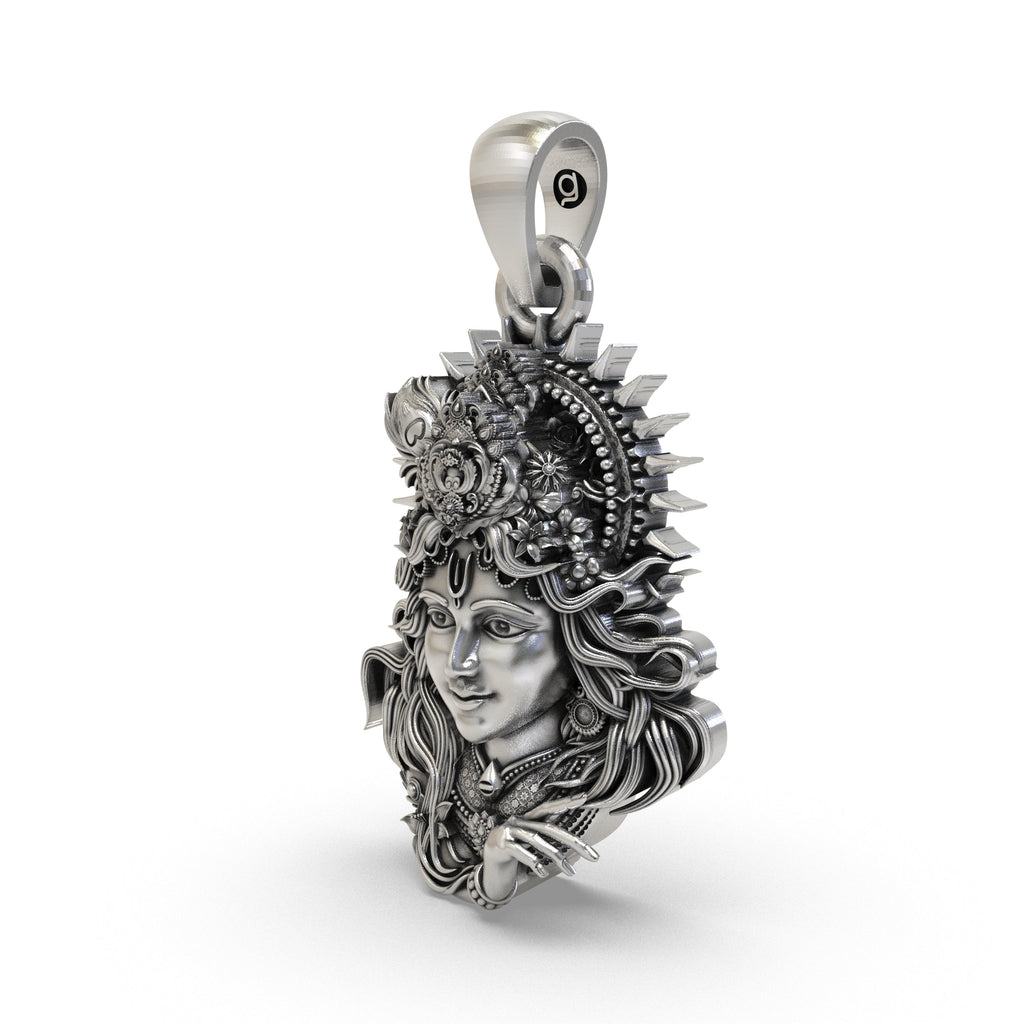Close-up detail of the antique oxidized 925 silver Krishna face pendant with Vaishnav tilak.