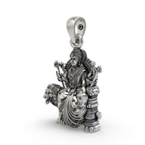 Close-up of the antique oxidized finish on the handcrafted 925 sterling silver Durga goddess pendant.