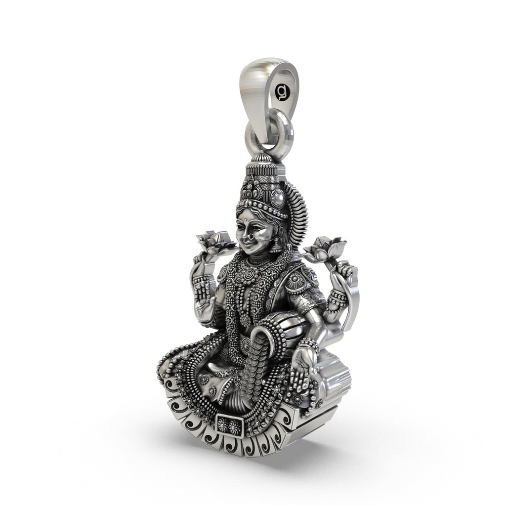 Close-up of the antique oxidized temple jewelry detailing on the silver Lakshmi Maa pendant.