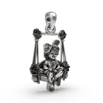 Side angle of the handcrafted 925 sterling silver Bal Krishna on a swing devotional pendant.