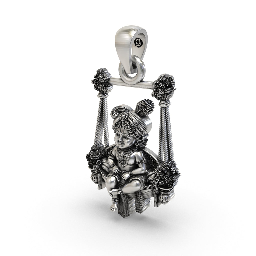 Beautifully polished antique silver Bal Gopal swing pendant presented in gift-ready packaging.