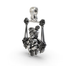 Beautifully polished antique silver Bal Gopal swing pendant presented in gift-ready packaging.