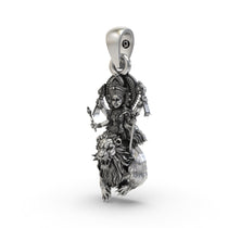 Close-up of the antique oxidized finish on the pure silver Navdurga icon pendant.