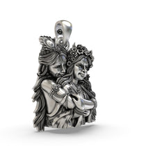 Angled view of the 30mm handcrafted silver Radha Krishna pendant displaying the front-facing bail.