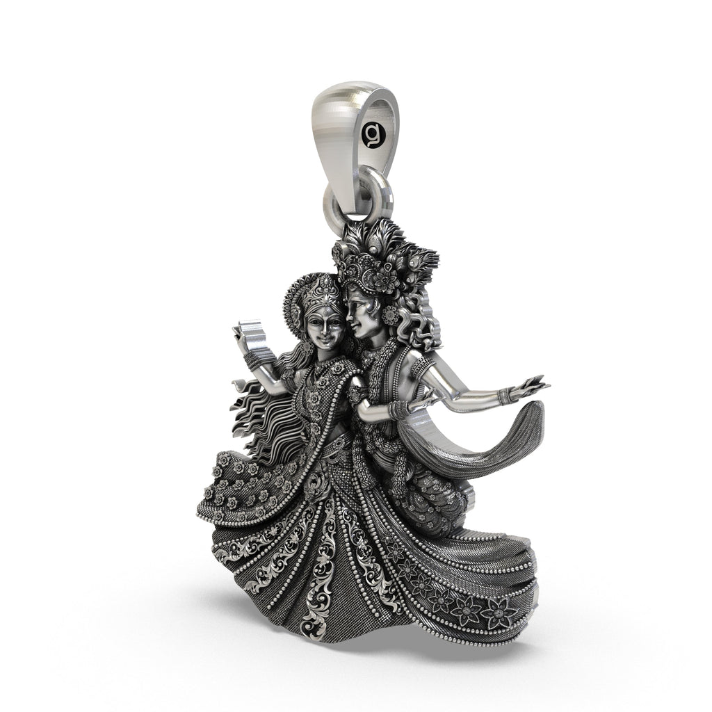Close-up detailing the floral motifs on the handcrafted Radha Krishna dancing silver pendant.