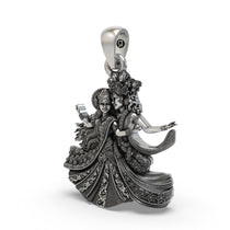 Close-up detailing the floral motifs on the handcrafted Radha Krishna dancing silver pendant.