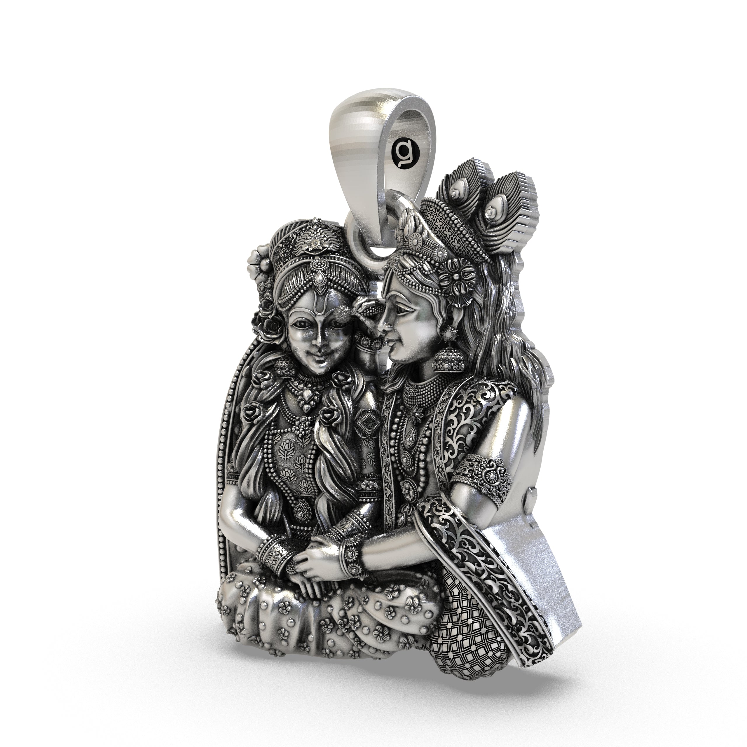 Close-up detailing of the handcrafted silver Radha Krishna pendant showing floral crown and jewels.