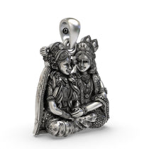Side angle of the 925 silver Radha Krishna devotional pendant highlighting the high-relief carving.