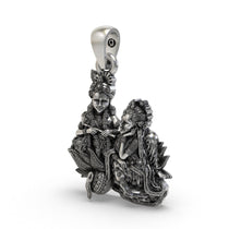 Close-up detail of handcrafted 925 silver Radha Krishna pendant showing intricate peacock motifs.