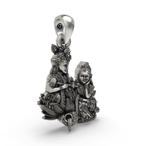 Side profile of solid 925 silver Radha Krishna necklace pendant highlighting the high relief.