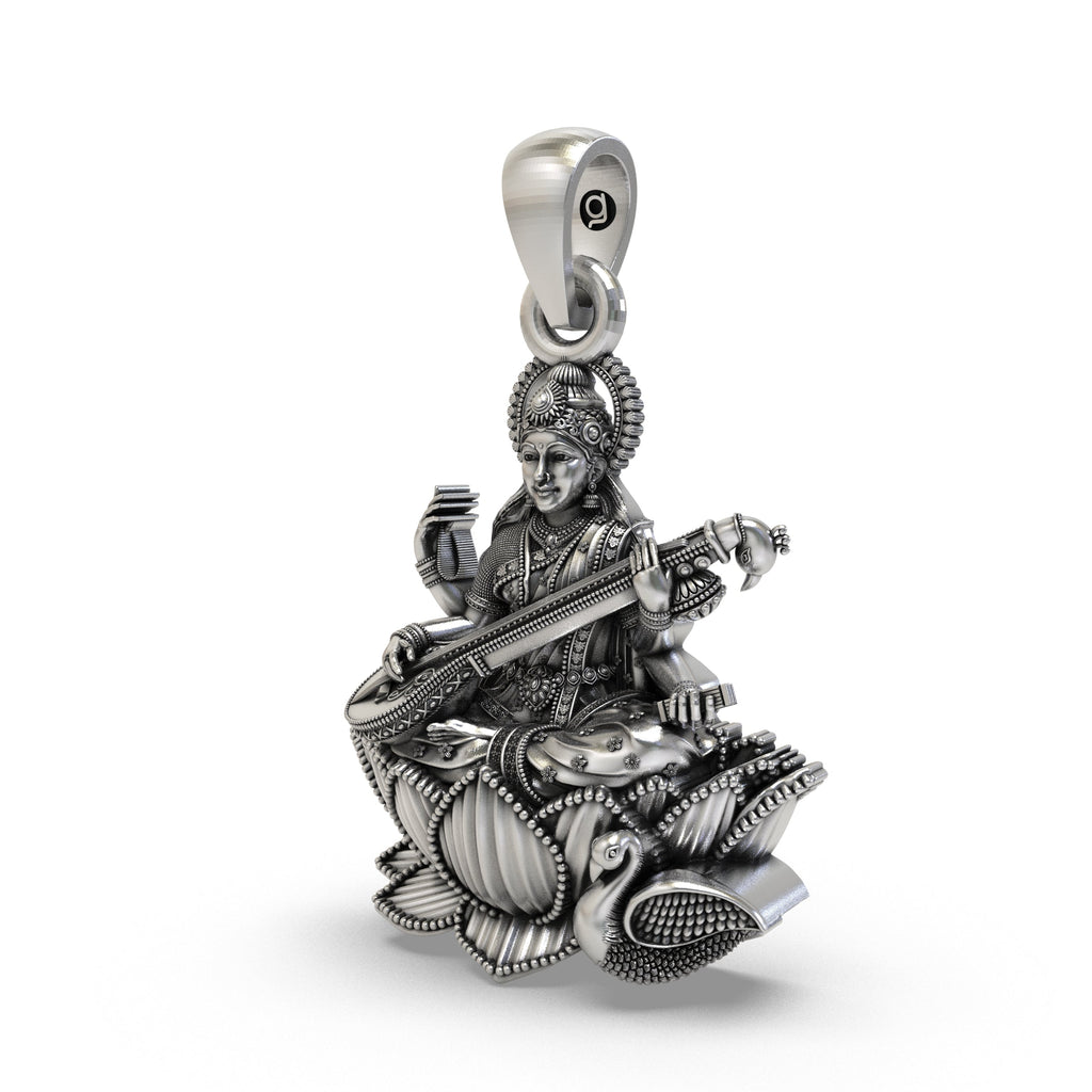 Close-up of the antique oxidized finish on the sterling silver Saraswati idol necklace.