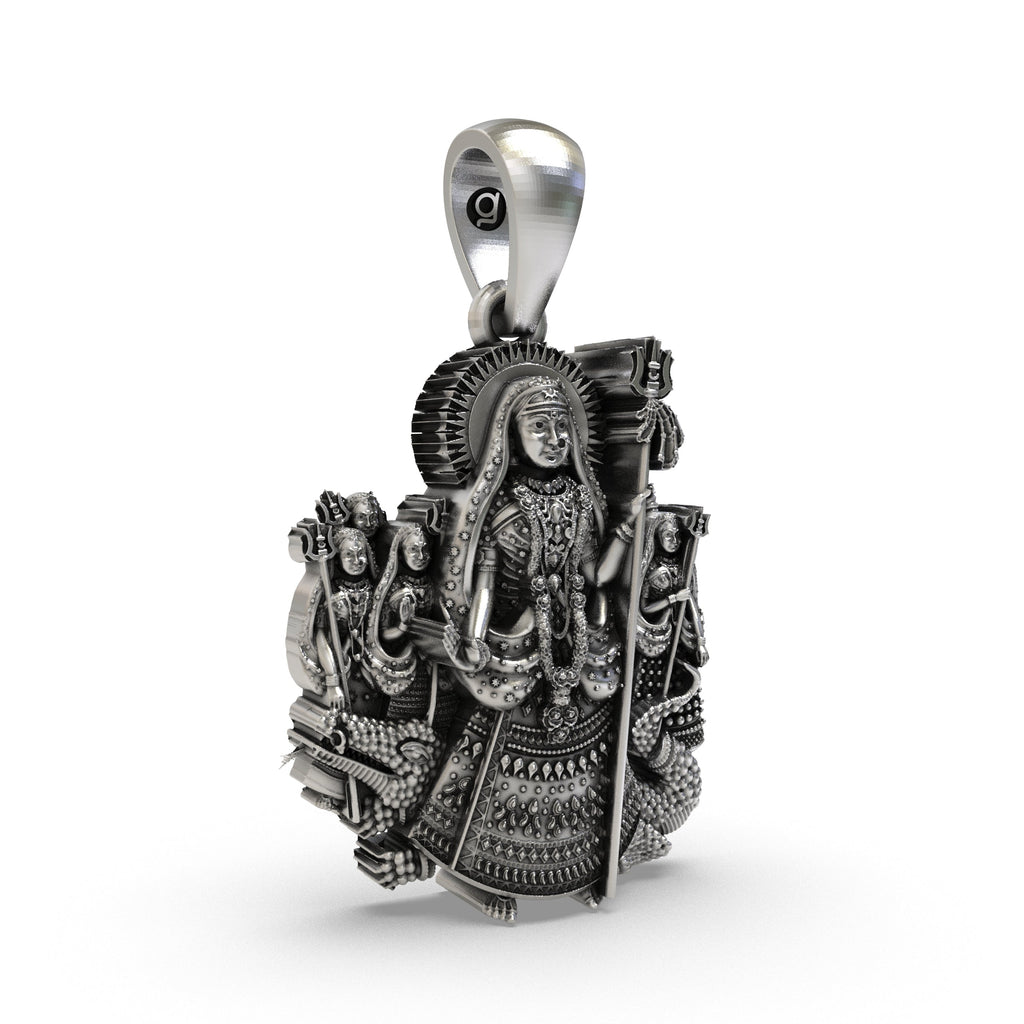 Side angle of the handcrafted Khodiyar Maa silver pendant showing the front-facing bail and crown.