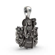 Side angle of the handcrafted Khodiyar Maa silver pendant showing the front-facing bail and crown.