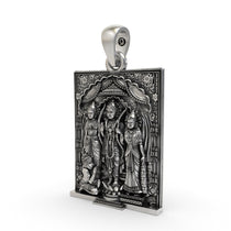 Close-up detail of the oxidized finish on the handcrafted silver Ram Darbar temple jewelry pendant.