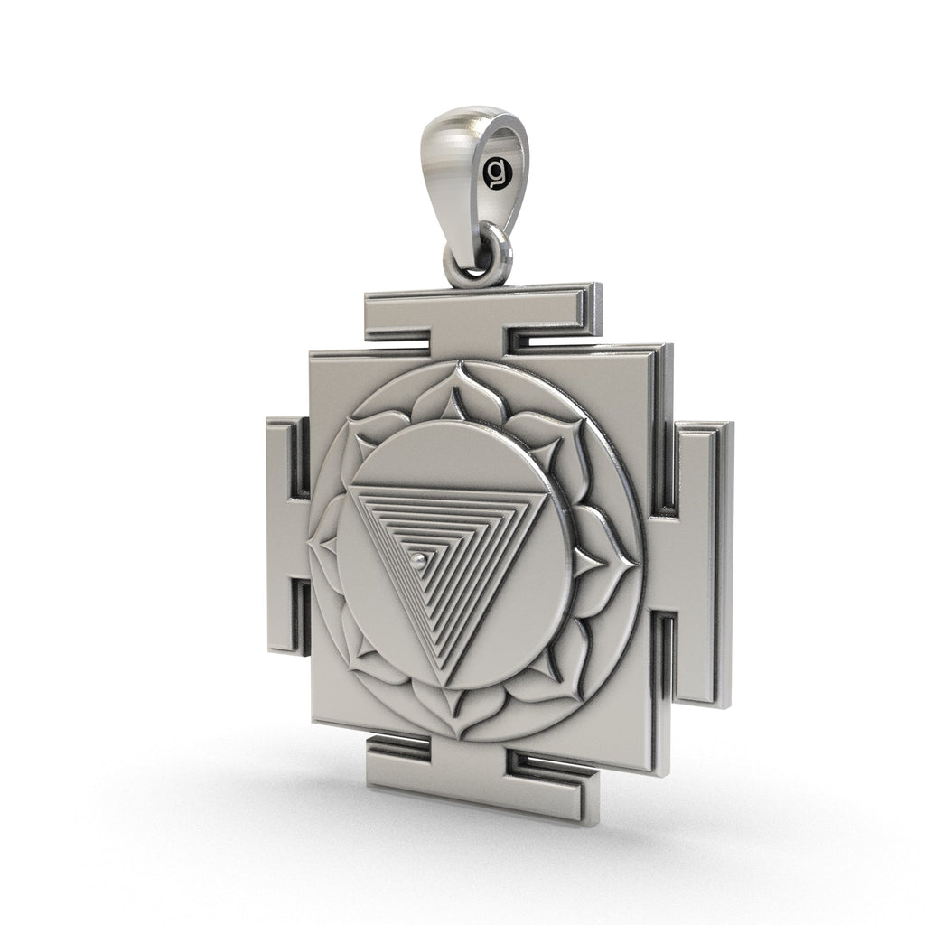 Close-up of the polished pure silver Tripura Bhairavi Yantra charm highlighting its spiritual energy.