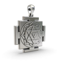 Reverse side of the sacred Dhumavati Yantra silver pendant featuring lightweight hollow jali work for comfort.
