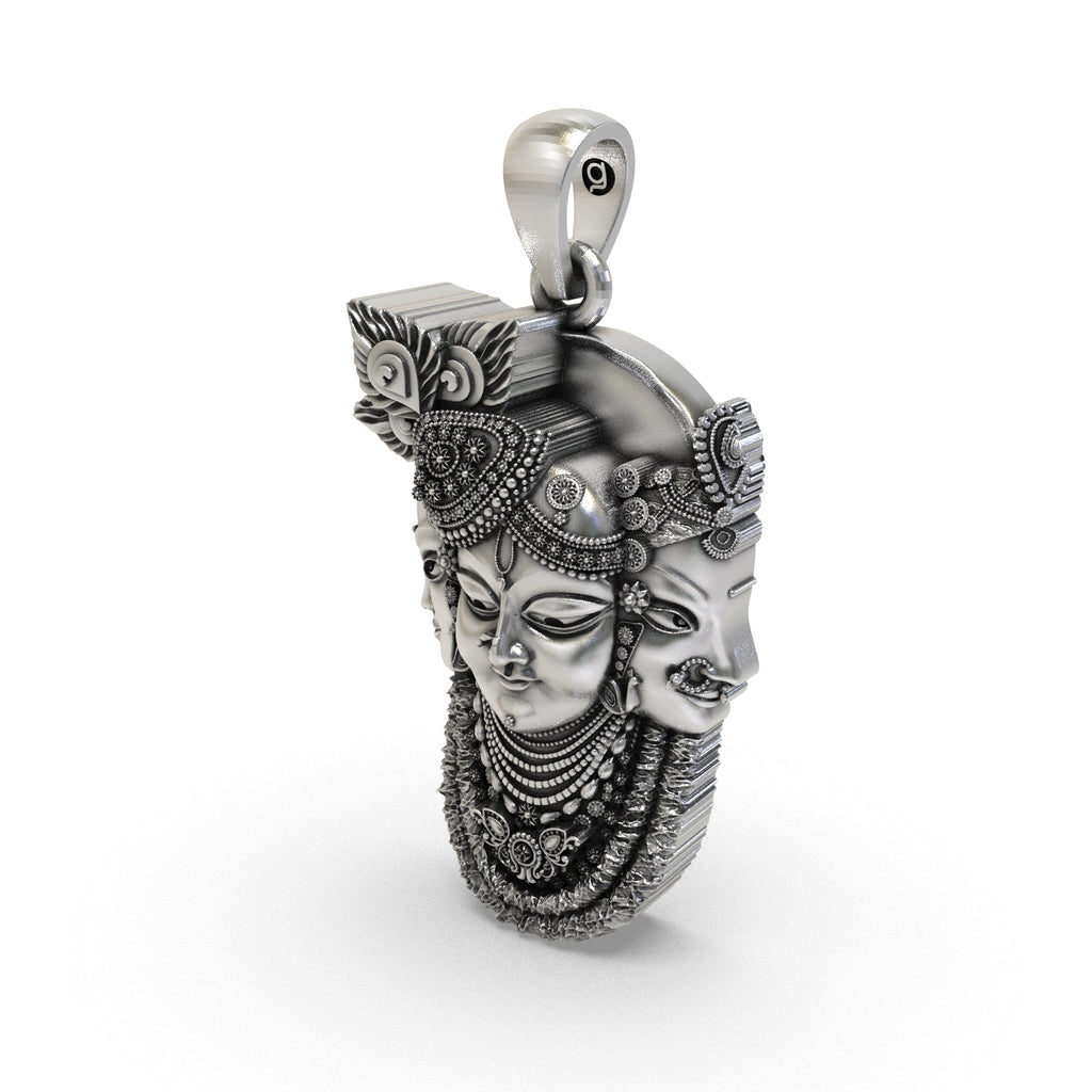 Beautiful worn look of the 925 Silver Trimukhi Shrinathji Pendant displaying its 30mm antique finish.
