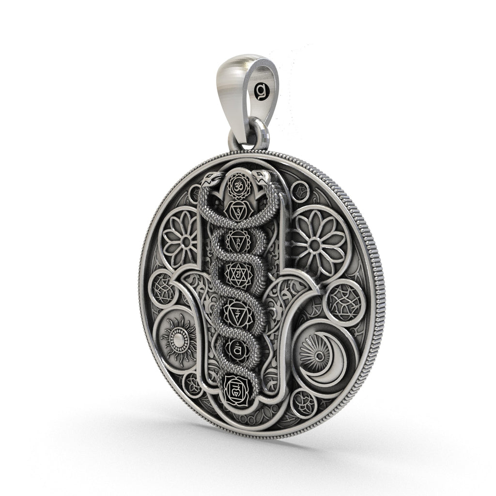 Close-up oxidized 925 silver chakra pendant detailing