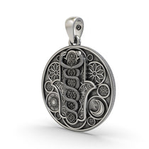 Close-up oxidized 925 silver chakra pendant detailing