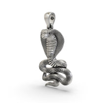 Close-up oxidized serpent pendant detailing