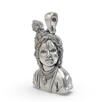 Close-up of Laddu Gopal silver pendant craftsmanship