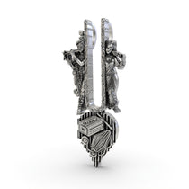 Angled profile of the Radha Krishna silver pendant, highlighting the detailed carvings and antique oxidized finish.