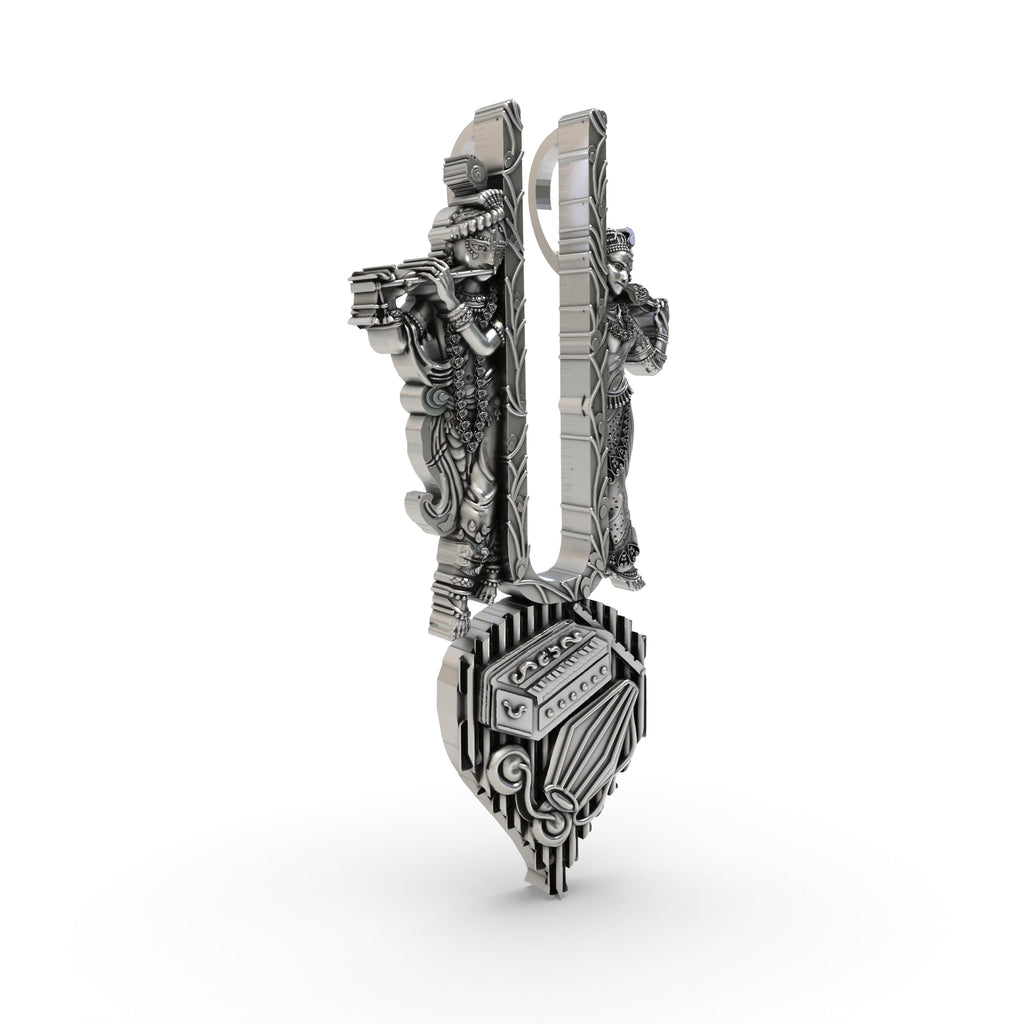 Close-up of the Alankar Radha Krishna tilak pendant showing Krishna with flute and Radha with harmonium details.