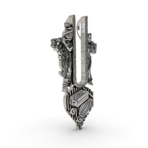Close-up of the Alankar Radha Krishna tilak pendant showing Krishna with flute and Radha with harmonium details.