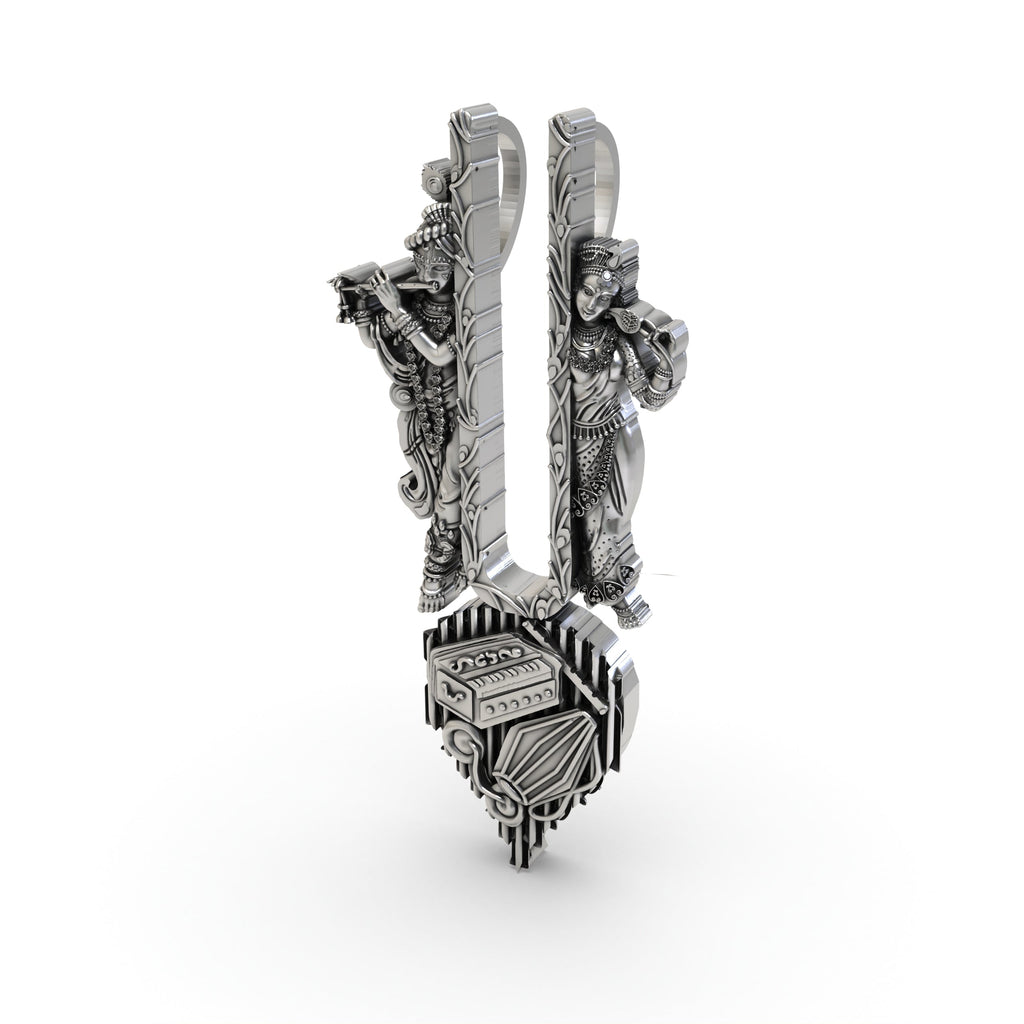 The Radha Krishna musical tilak pendant in 925 sterling silver, shown against a neutral background for scale.