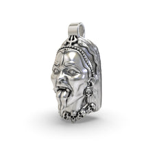 Angled view of the sterling silver Kali Maa face pendant highlighting the intricate details of the goddess's trident.