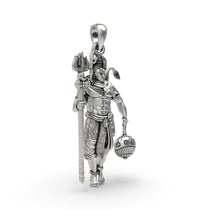 Close-up detail of the intricately carved faces on the 925 sterling silver Shiv and Hanumanji god pendant.