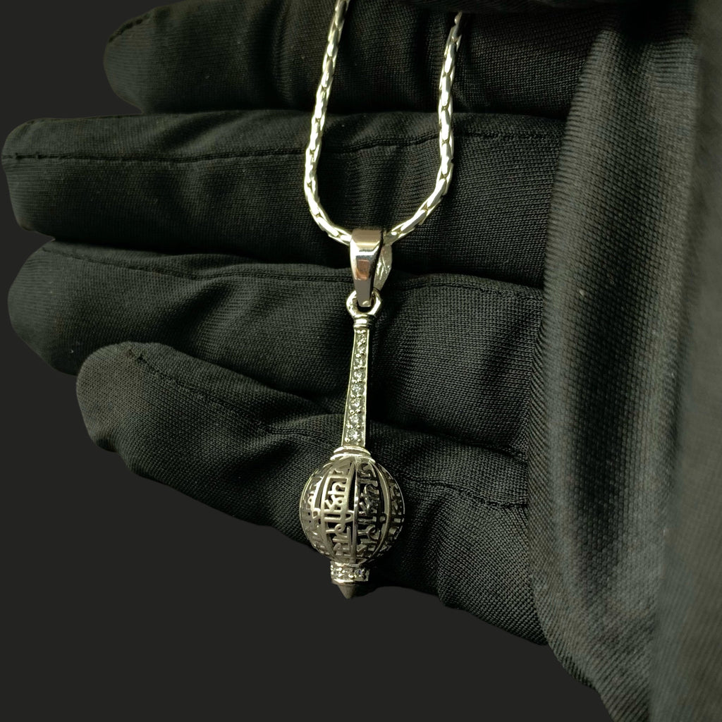 Beautifully crafted Bajrangbali gada silver pendant shown resting gently on a flat surface.