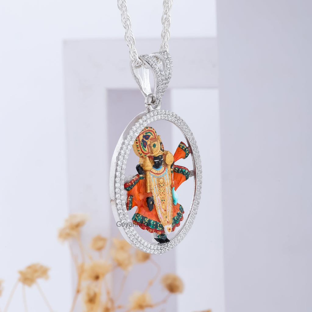 The Dwarkadhish Enamel 925 Silver Pendant on a dark background to emphasize its vibrant colors and diamond sparkle.