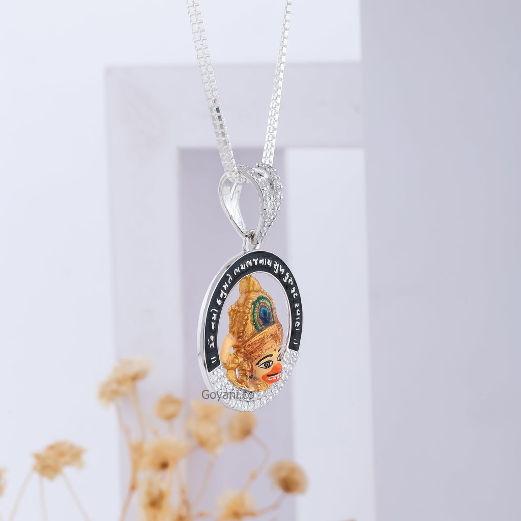 A detailed close-up of the Sarangpur Hanumanji pendant, highlighting its brilliant diamonds and silver work.