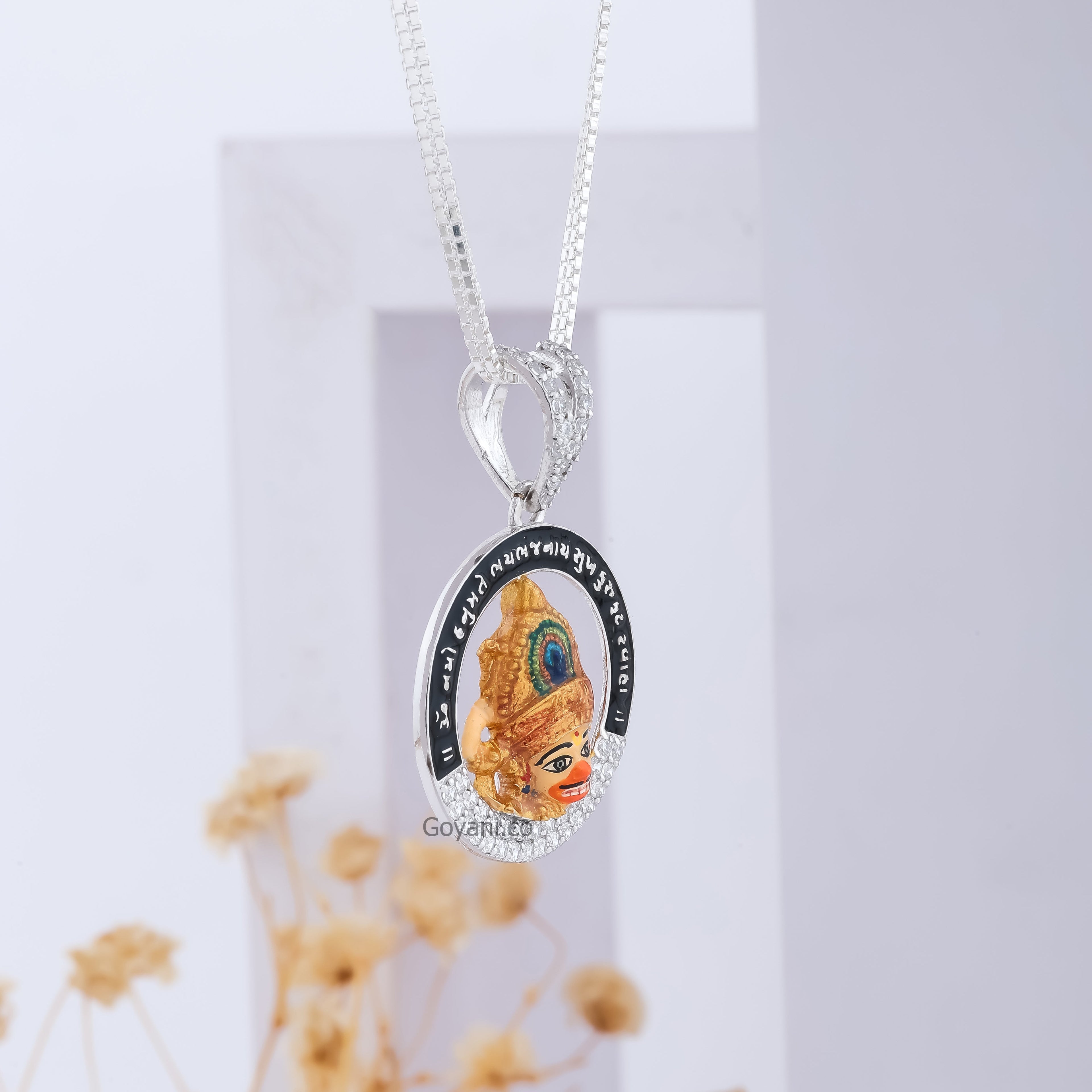 A detailed close-up of the Sarangpur Hanumanji pendant, highlighting its brilliant diamonds and silver work.