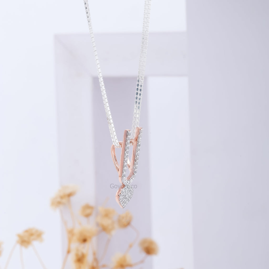 The elegant ISKCON Tilak locket pendant in sterling silver, shown for scale and its graceful devotional presence.