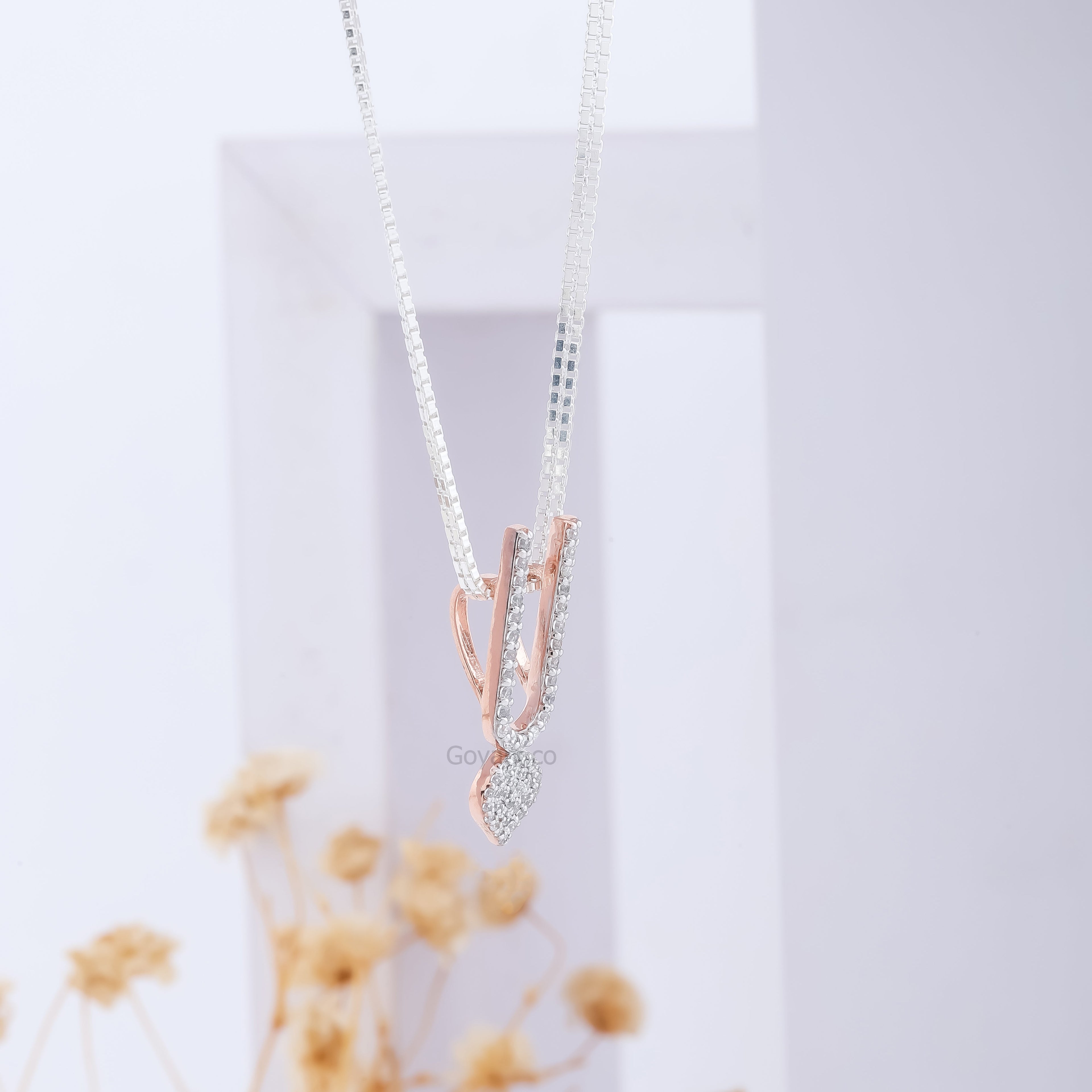The elegant ISKCON Tilak locket pendant in sterling silver, shown for scale and its graceful devotional presence.