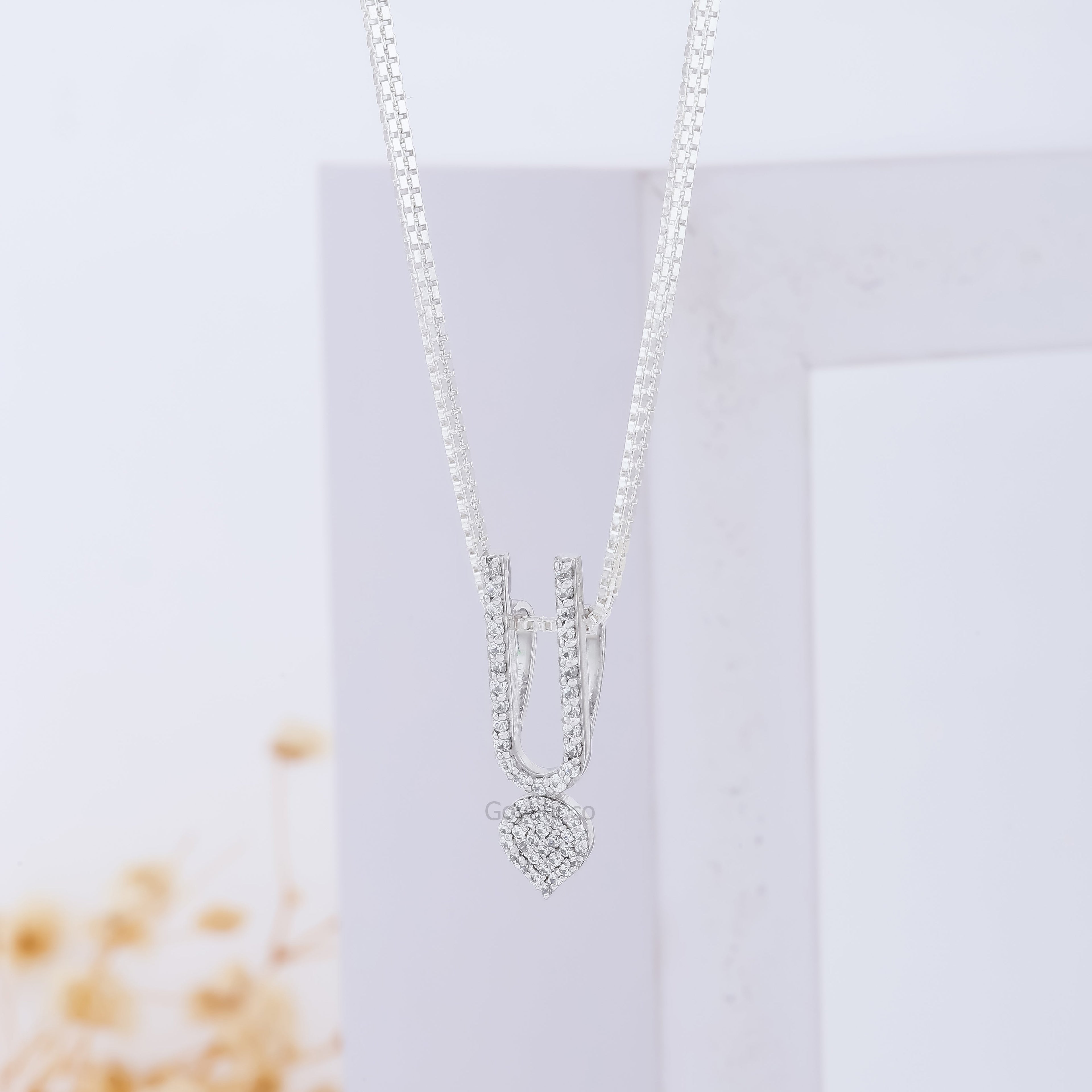 Angled view of the devotional ISKCON Tilak Pendant in pure 925 silver, highlighting its premium polished finish.