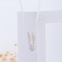 Close-up detail of the sparkling diamond accent on the pure 925 silver ISKCON Tilak Pendant by Alankar Jewelry.