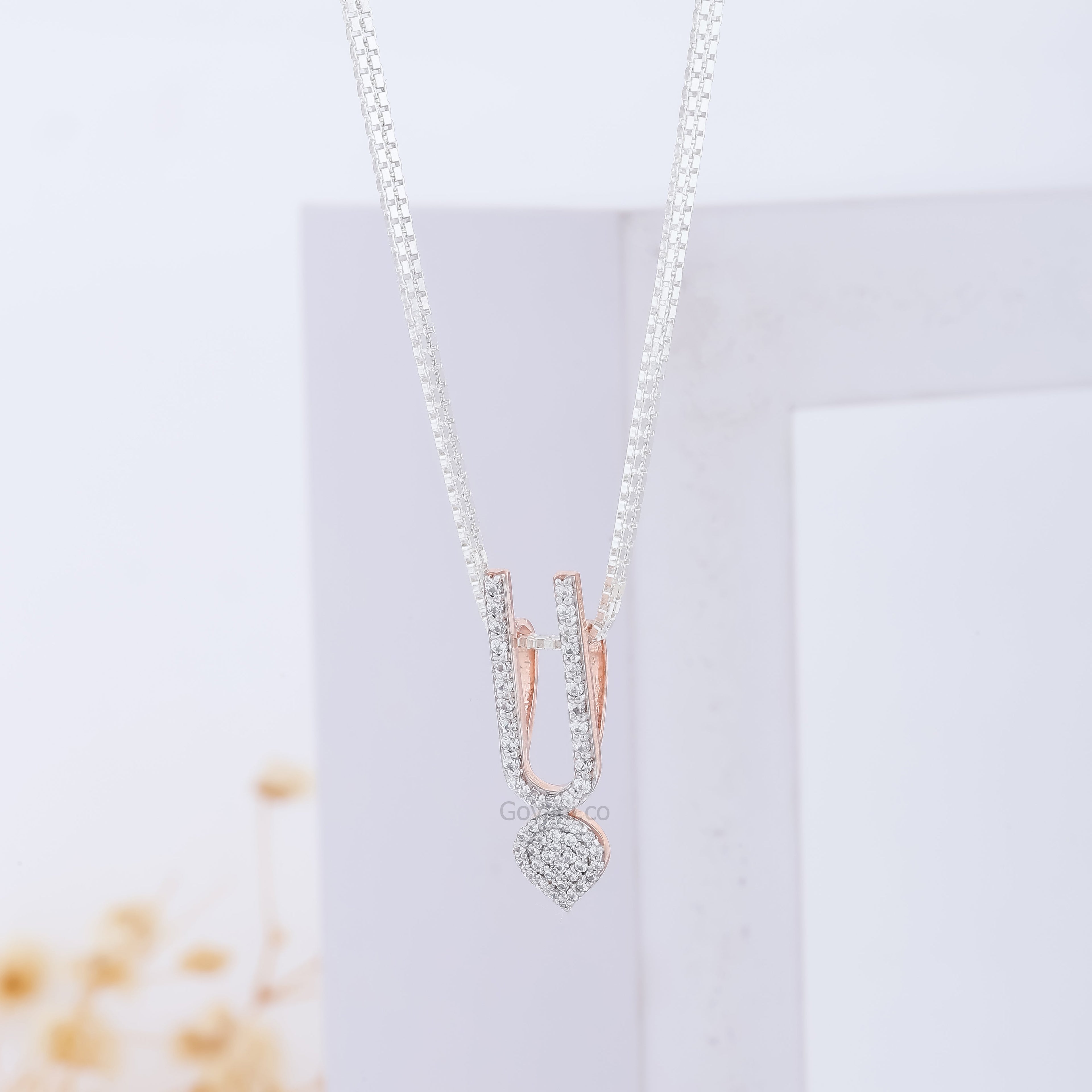 Close-up detail of the sparkling diamond accent on the pure 925 silver ISKCON Tilak Pendant by Alankar Jewelry.