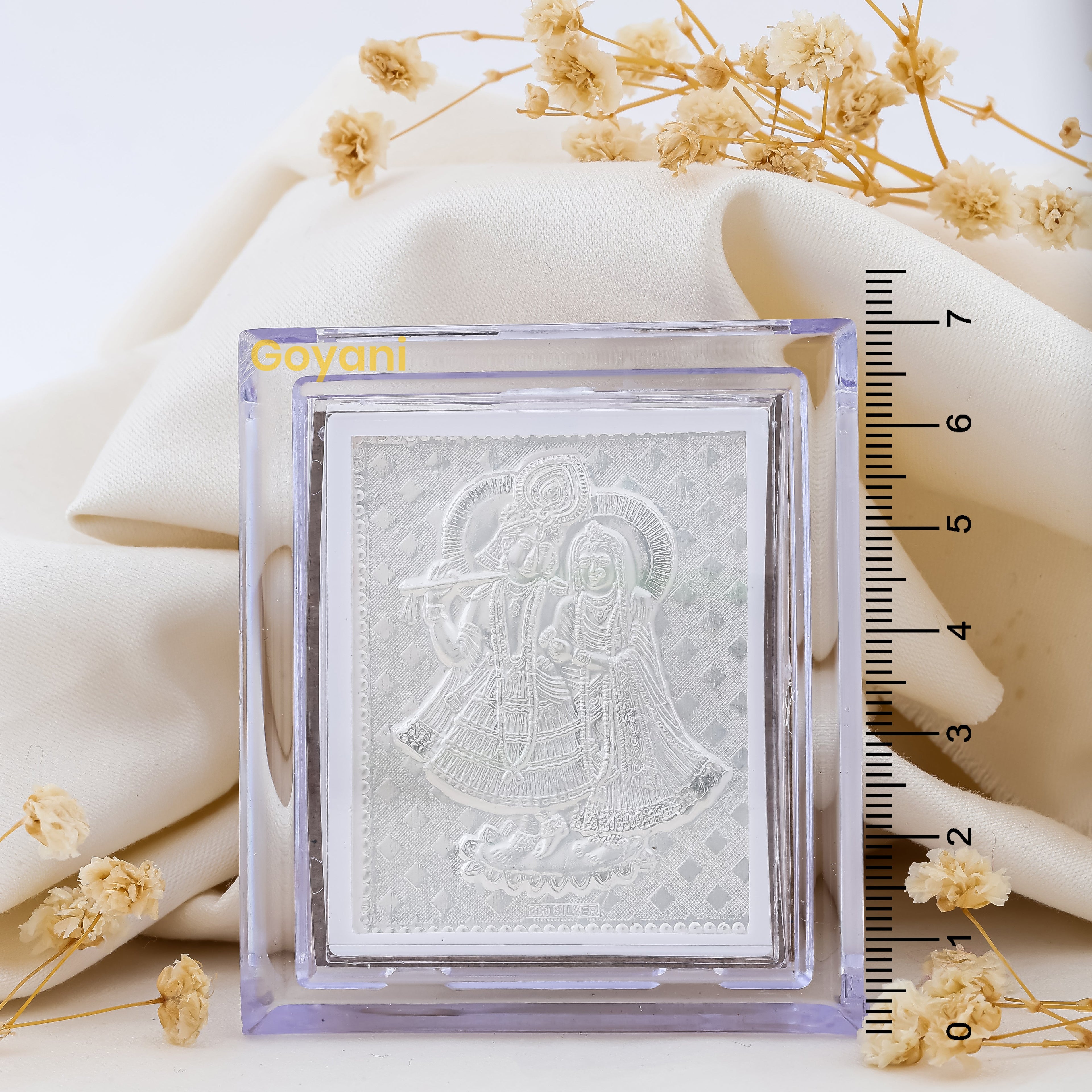 A detailed close-up of the 7cm Radha Krishna idol, highlighting the intricate silverwork and high-polish finish.