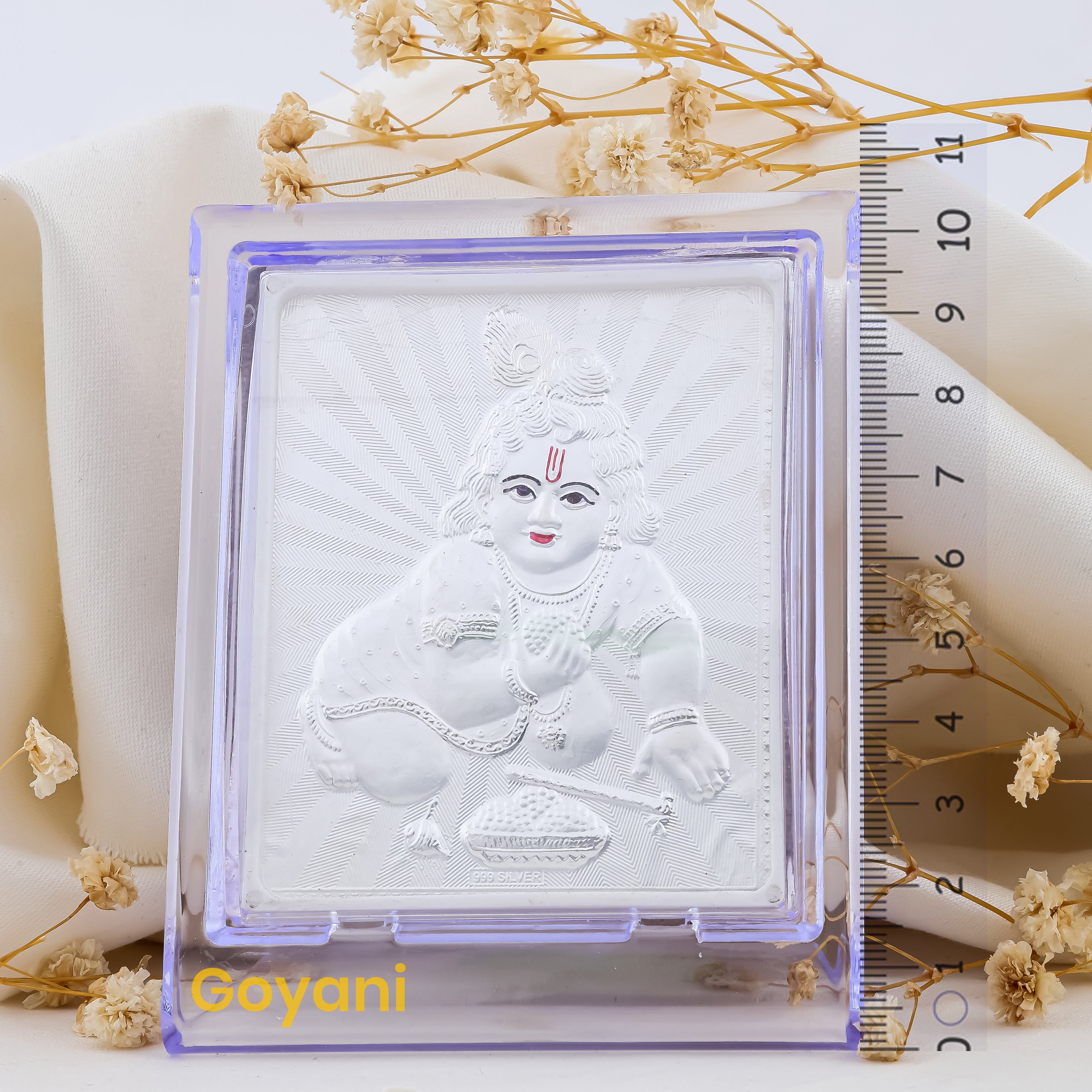 Close-up detail of the 10.5 cm 999 pure silver Laddu Gopal stand, showcasing its high-polish finish.