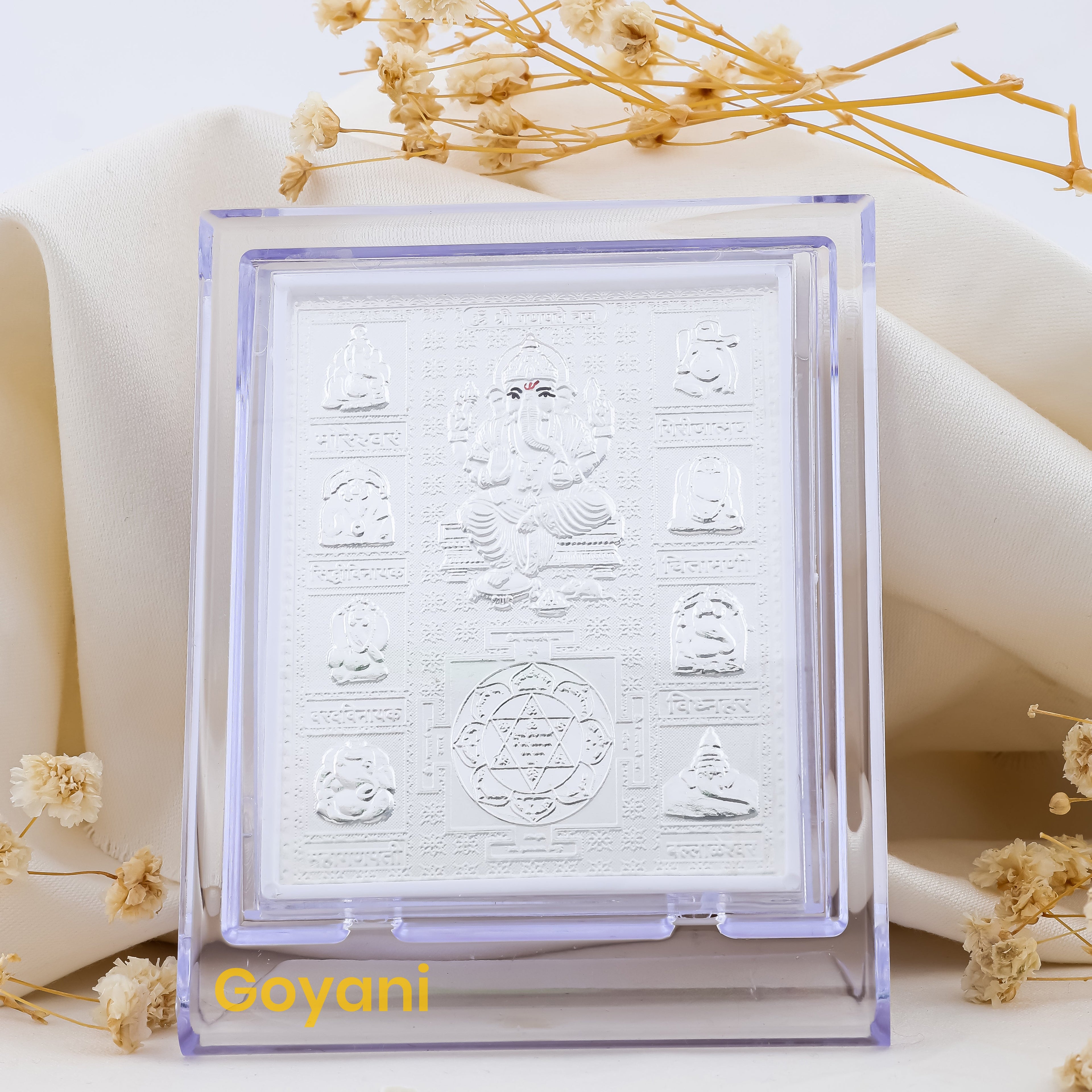 A detailed front view of the 999 pure silver Ganesha idol on a sacred Yantra stand, ideal for home altars.